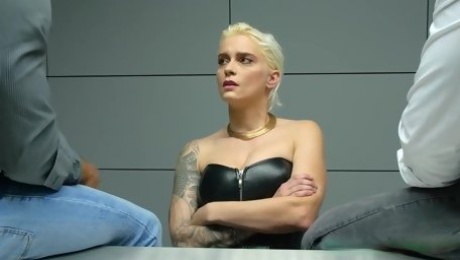 Inked blonde babe, Mila Milan is sucking two cocks during an interrogation in a police station