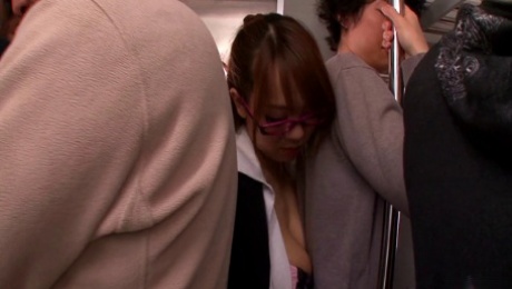 Hitomi Tanaka pleases a guy with blowjob and titjob in a crowded bus