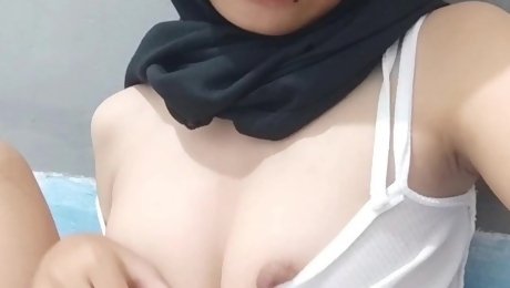 A hot slut in a hijab records a sex video for her boyfriend where she masturbates