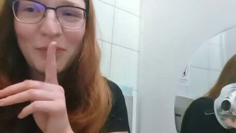 Cute Redhead Teen masturbates on public toilet