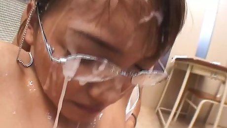 Hot Japanese teacher lets her students cum on her face