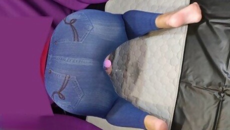 Big ass in jeans peeing with vibrator