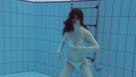 White swimsuit with tattoos babe Roxalana Cheh underwater
