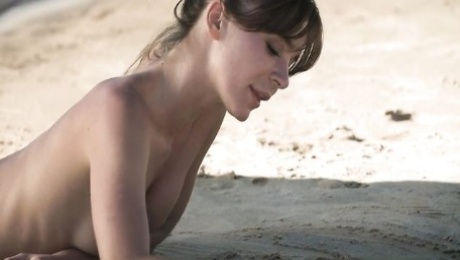 Soloing goddess Natalia E shows her slender body on the beach